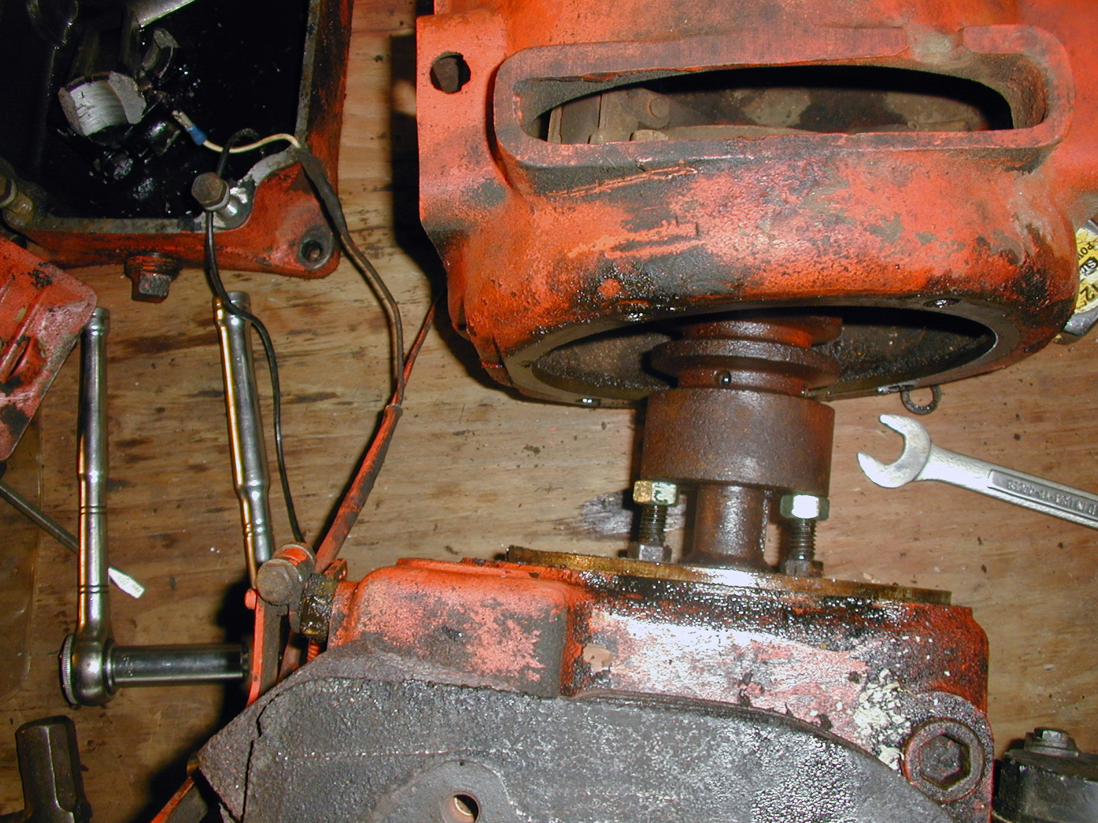 The nut & bolt method of removing Power King clutch flywheel.