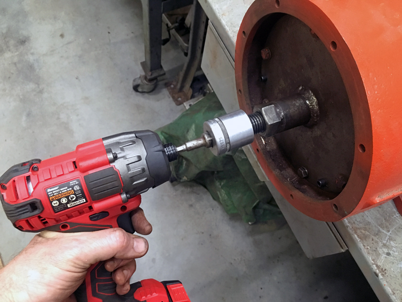 I use an impact gun with this puller, after fully removing all set screws and securing the puller to the flywheel. (Photo © Russ Chastain)
